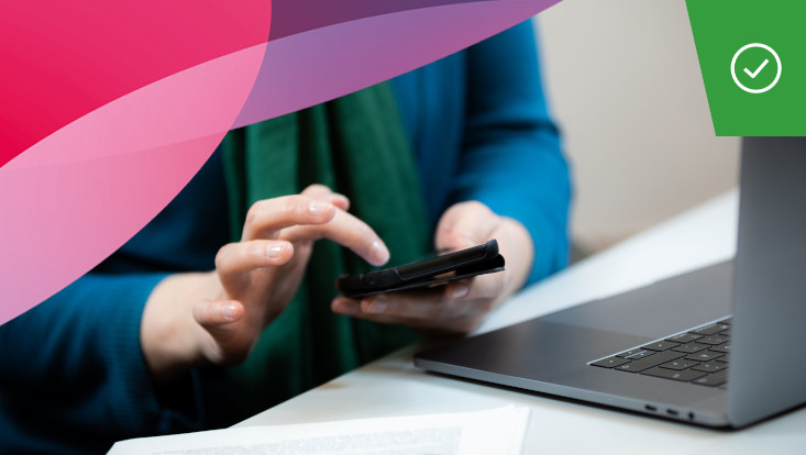Woman typing into a smartphone