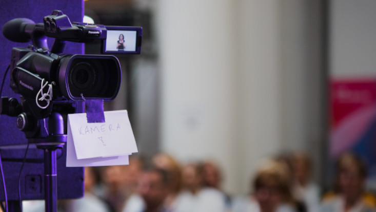 Video camera filming a lecture