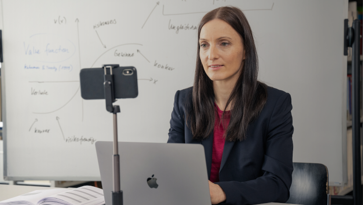 Woman streaming herself at a lecture