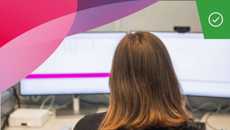 Person looks at two screens